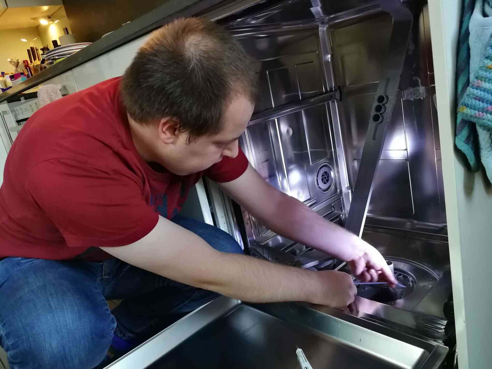Hannes working on his dishwasher